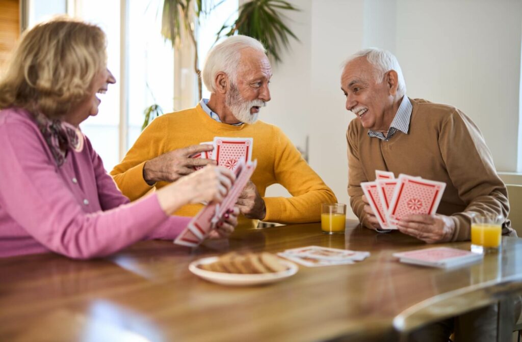 A group of older adults enjoy the socialization opportunities during their short-term stay in a senior community.